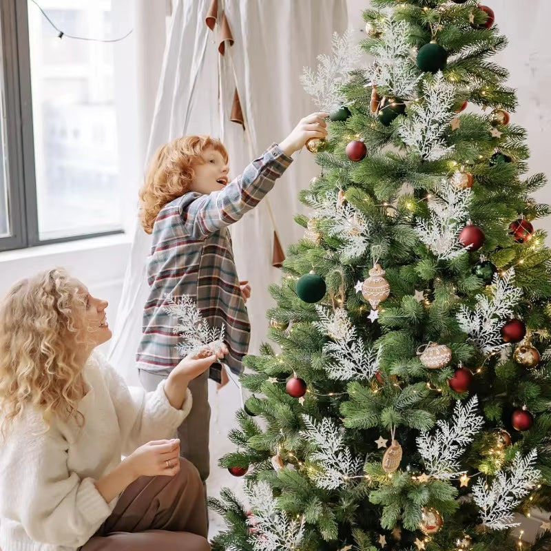 Person carrying a bundle of white artificial pine branches for holiday decorating