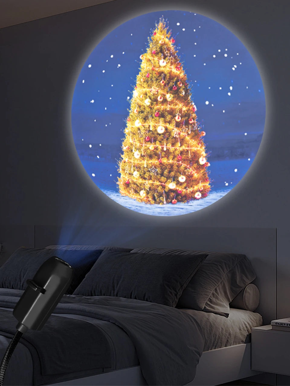 Blue-toned room with a Christmas tree silhouette projection in the window.