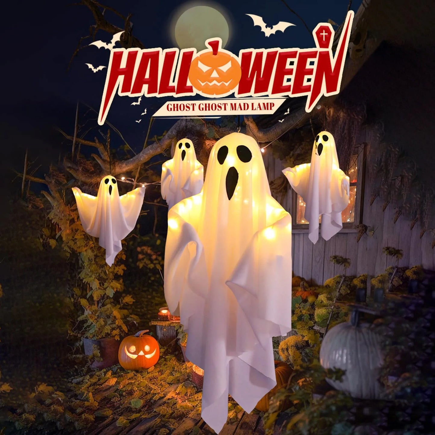 Window display with hanging ghosts and Halloween banner.