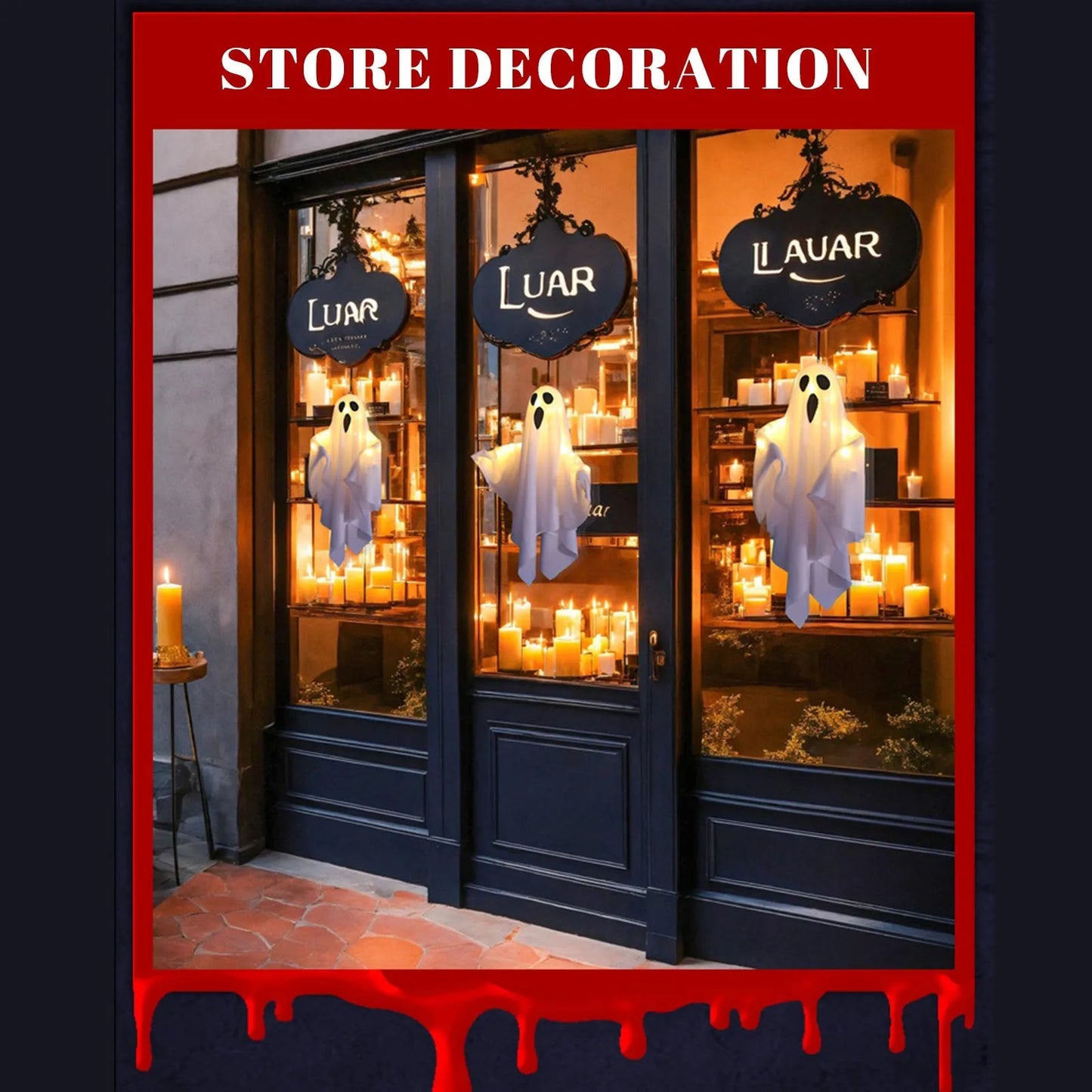 Retail window scene with several hanging ghosts and decorations.