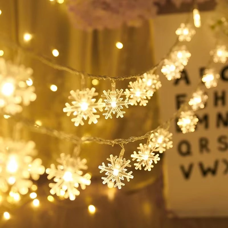 Rows of warm white snowflake string lights creating a cozy holiday backdrop