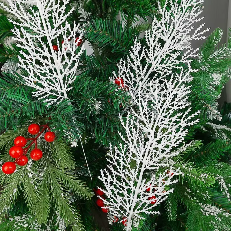 Door wreath decorated with white artificial pine needle sprays for a snowy look