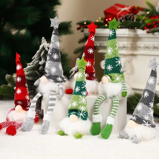 Set of glowing faceless Christmas gnome dolls in red, green, and grey hats with LED lights