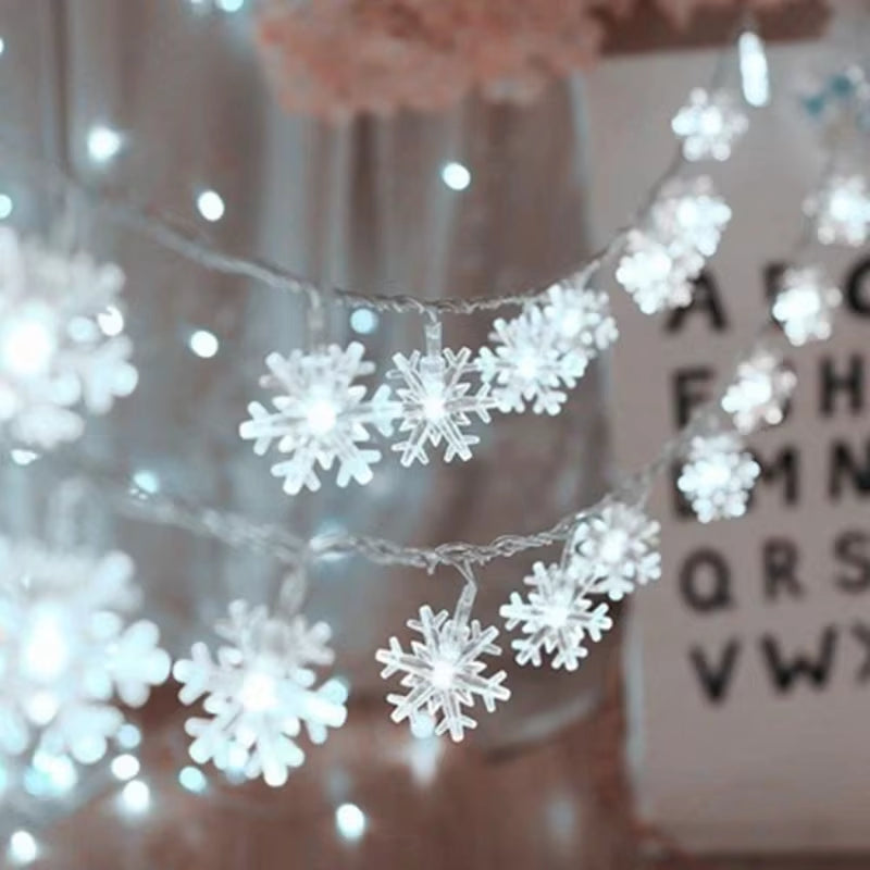 Rows of cool white snowflake LED string lights hanging for winter décor