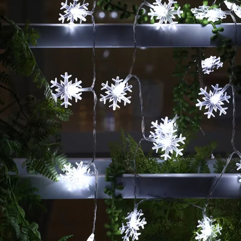 Cool white snowflake string lights arranged as a wall garland for winter décor