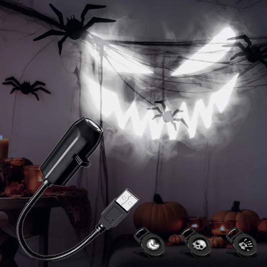 USB Halloween projector casting a large grinning face on a wall with pumpkins and bats.