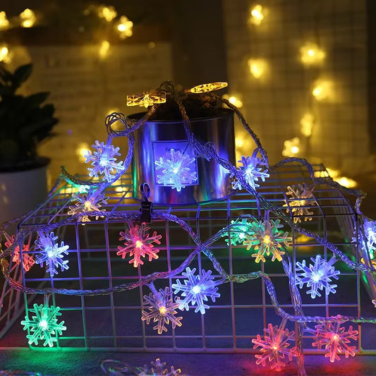Multicolor snowflake LED string lights glowing on a wire frame for Christmas décor