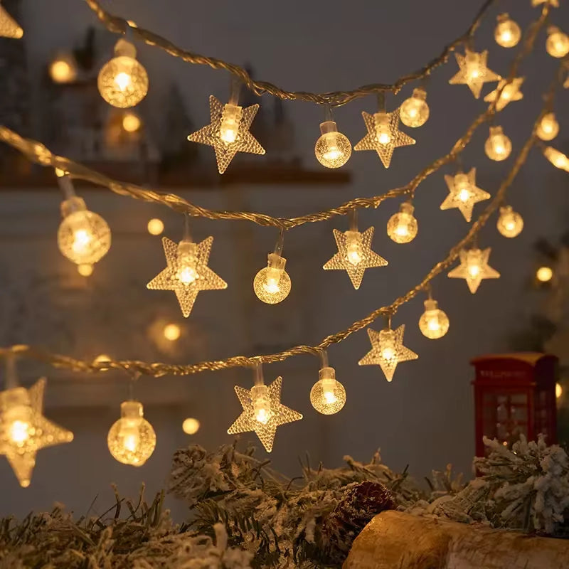 Layered warm white snowflake string lights used as indoor Christmas décor