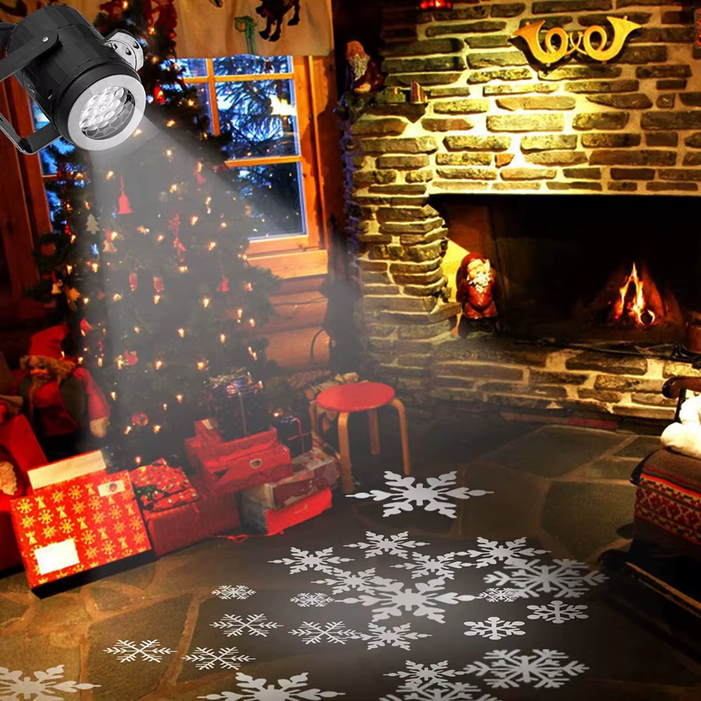 Snowflake projector lighting a Christmas tree and garden with falling flake patterns