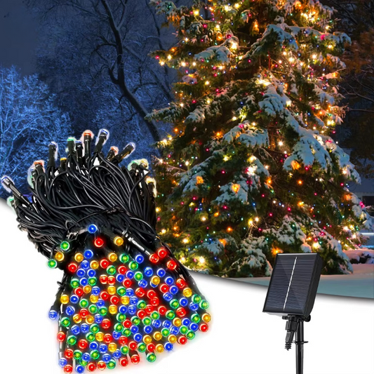 Multicolor LED solar string lights with stake solar panel by a snowy Christmas tree.