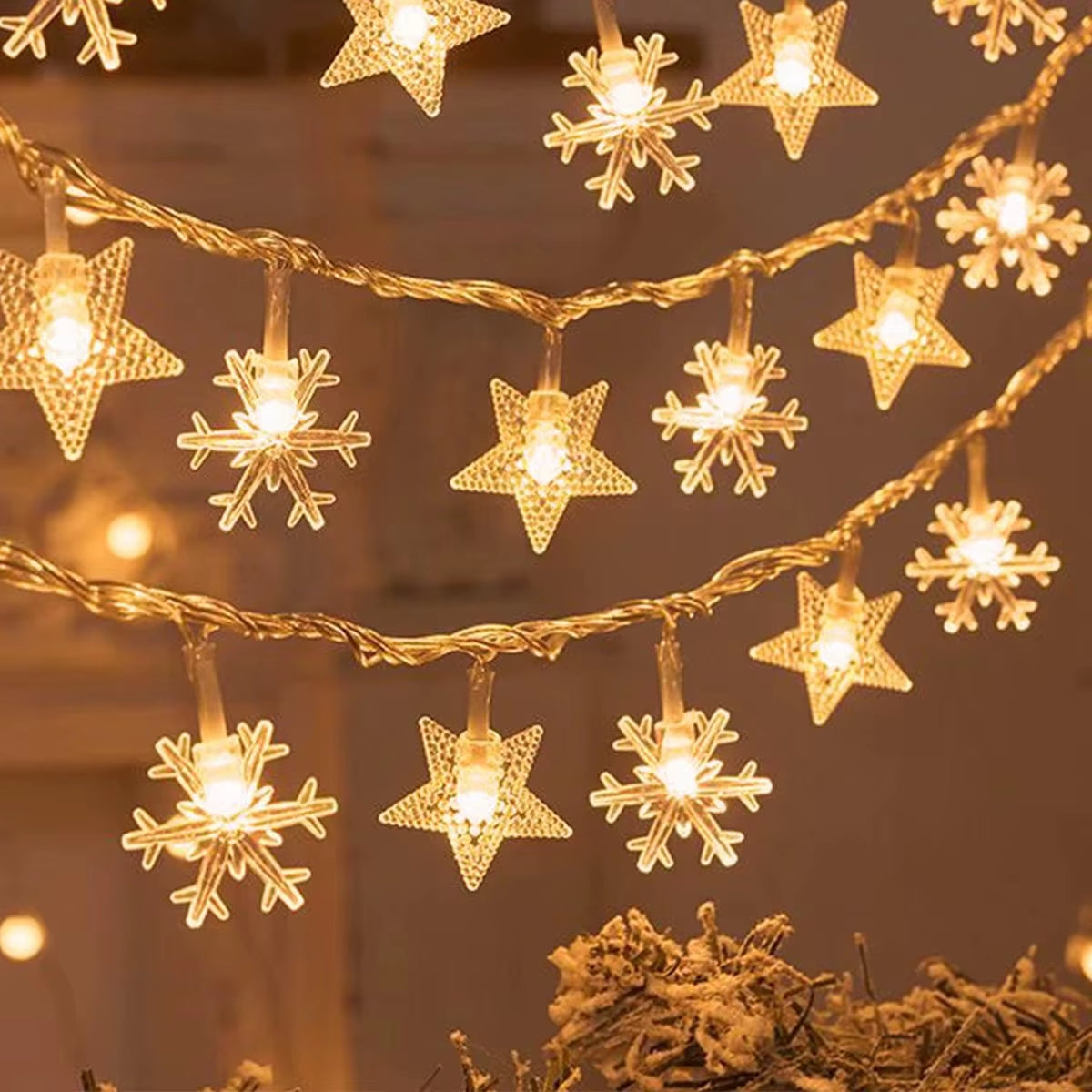 Warm white star and globe bulb string lights combined for a festive display